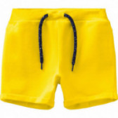 Къс панталон от органичен памук, жълт за момче Name it 107123 