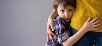 Sad,little,child,,boy,,hugging,his,mother,at,home,,isolated