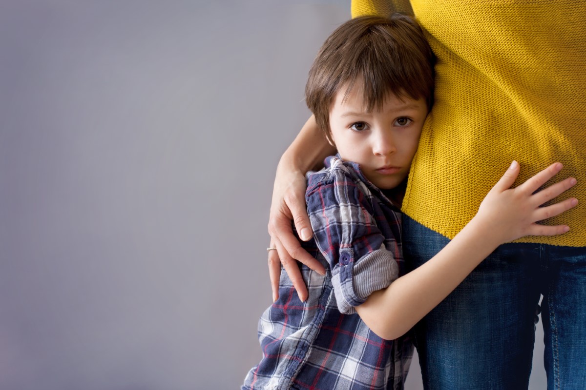 Sad,little,child,,boy,,hugging,his,mother,at,home,,isolated