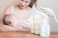 Manual,breast,pump,and,mother,feeding,at,background,,mothers,breast
