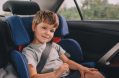 Little,boy,sitting,in,safety,car,seat