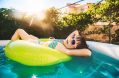 little,girl,in,sunglasses,is,resting,in,inflatable,circular,pool